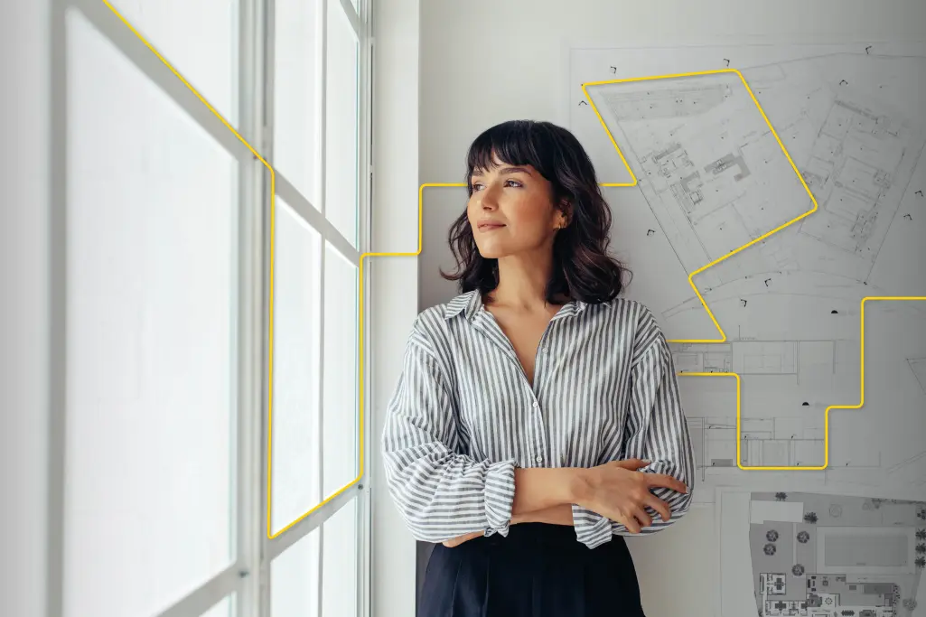 Arkitekt tittar ut genom fönster