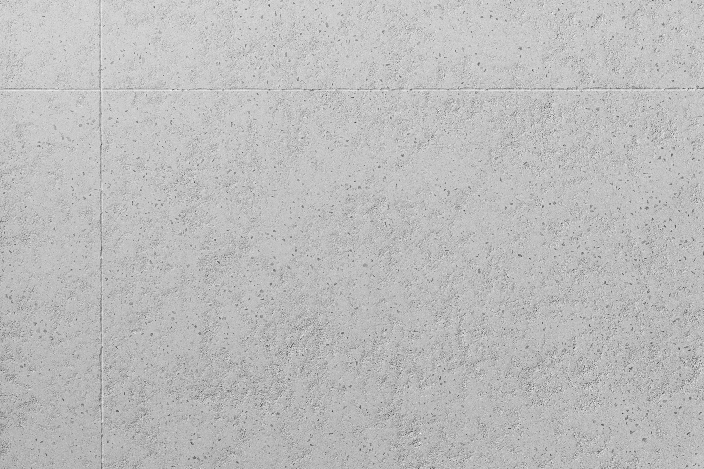 Ljusgrå betongliknande yta.