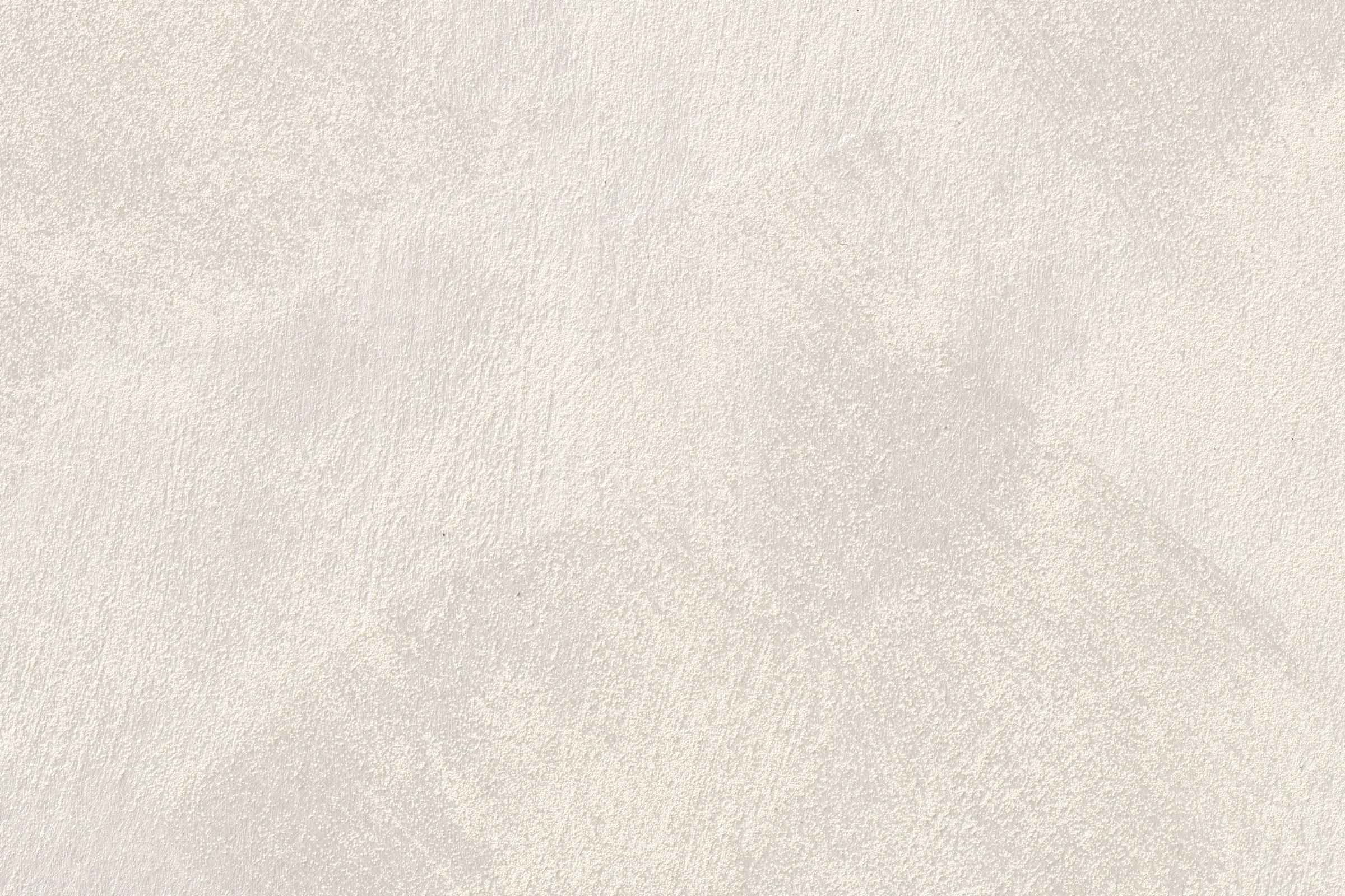 Ljusbeige glansig putsad yta.