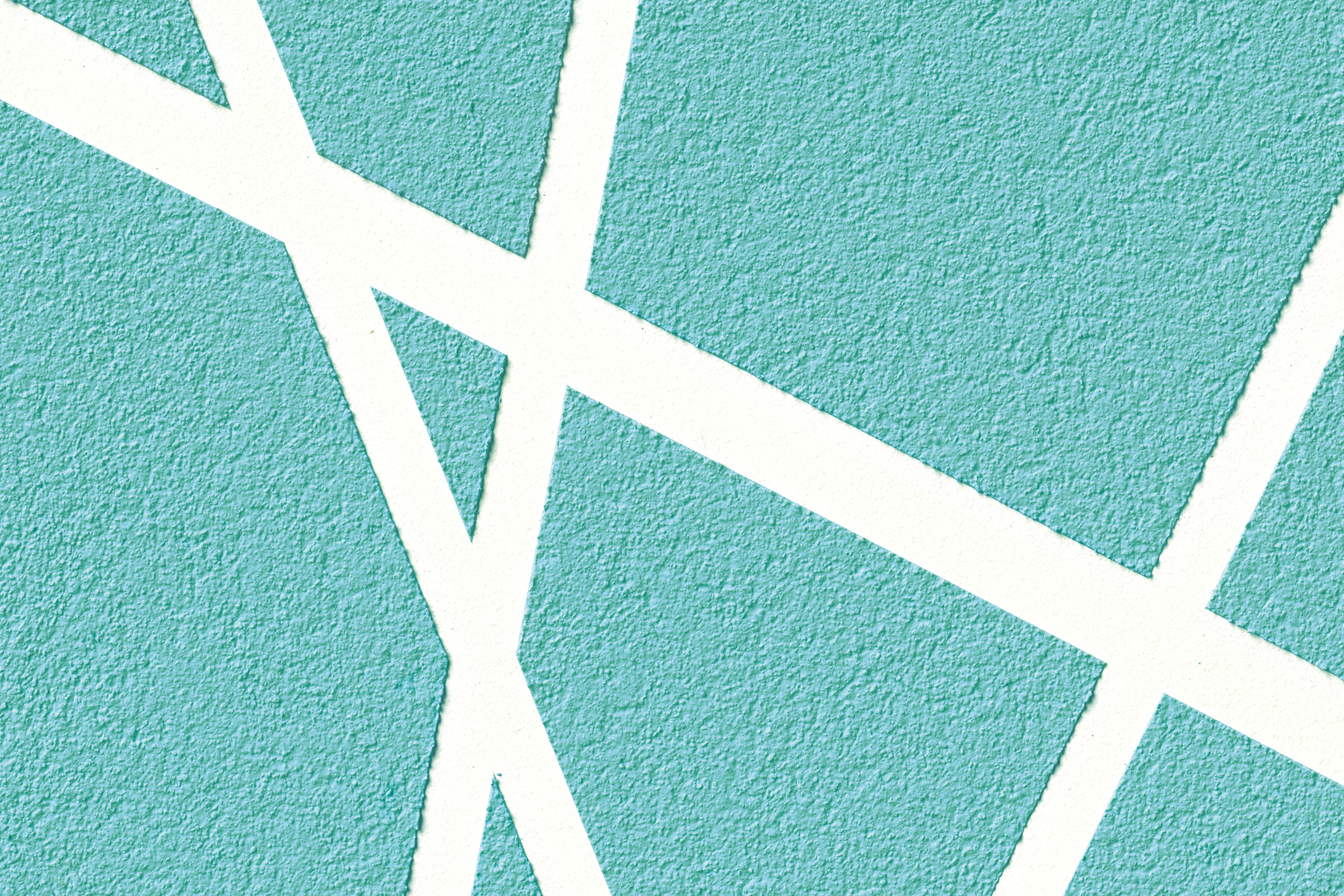 Putsad turkos yta med vita streck skapade genom stenciler.